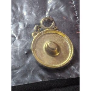 Diamonds International gold tone hat charm